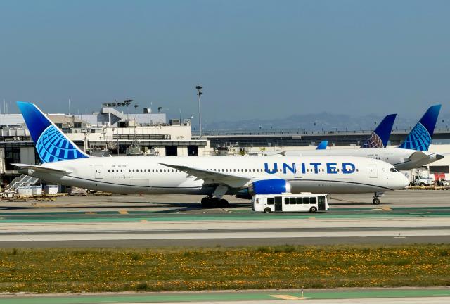 A United Boeing 787 Dreamliner taxis at Los Angeles International Airport in Los Angeles, California, on March 11, 2026. (Photo by Daniel SLIM / AFP)