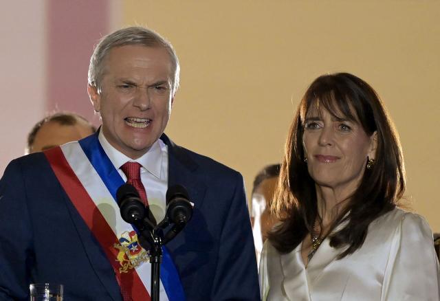 Chile's new President Jose Antonio Kast gives a speech from the balcony of La Moneda Palace next to his wife Maria Pia Adriasola in Santiago on March 11, 2026. Chile's most right-wing president in over three decades, Jose Antonio Kast, takes office on March 11, 2026, on a promise to tackle surging rates of violent crime and carry out mass migrant deportations. (Photo by Rodrigo ARANGUA / AFP)