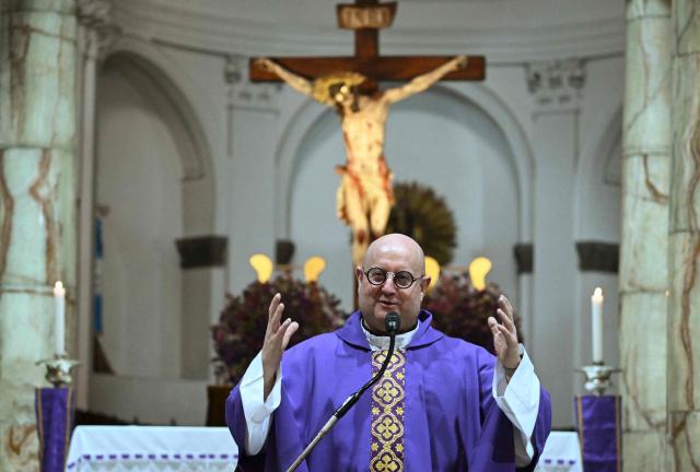 Guilherme Peixoto, a priest and DJ, celebrates a mass at Metropolitan Cathedral in Guatemala City on March 11, 2026. The Portuguese Catholic priest and DJ Guilherme Peixoto is visiting Guatemala for a concert on March 12. (Photo by JOHAN ORDONEZ / AFP)