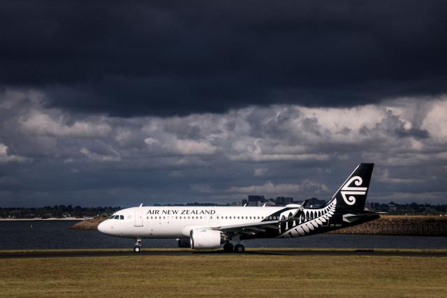 (FILES) An Air New Zealand Boeing 737 plane prepares to take off from Sydney International Airport in Sydney on January 14, 2026. New Zealand's national airline said March 12, 2026, it would cancel 1,100 flights over the next two months, pointing to the impact of the war in the Middle East. (Photo by DAVID GRAY / AFP)