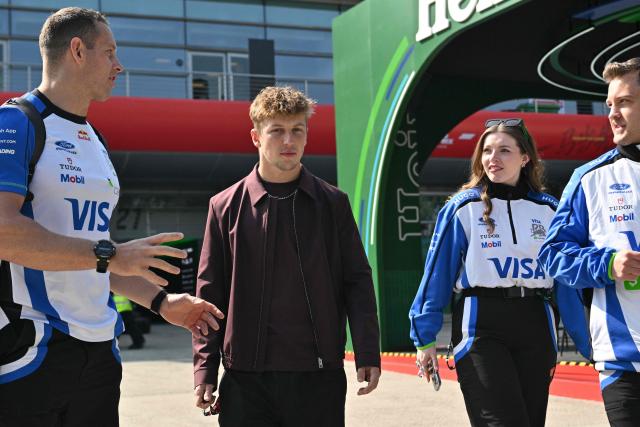 Racing Bulls' New Zealand driver Liam Lawson arrives to the paddock at the Shanghai International Circuit ahead of the Formula One Chinese Grand Prix in Shanghai on March 12, 2026. (Photo by Hector RETAMAL / AFP)