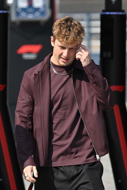 Racing Bulls' New Zealand driver Liam Lawson arrives to the paddock at the Shanghai International Circuit ahead of the Formula One Chinese Grand Prix in Shanghai on March 12, 2026. (Photo by Hector RETAMAL / AFP)