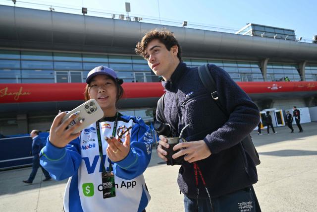 Alpine's Argentine driver Franco Colapinto arrives to the paddock at the Shanghai International Circuit ahead of the Formula One Chinese Grand Prix in Shanghai on March 12, 2026. (Photo by Hector RETAMAL / AFP)