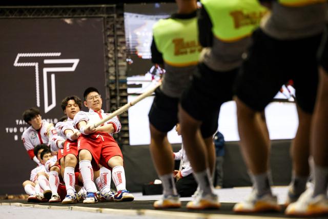 Hong Kong junior team of tug-of-war team competes in Taipei World Indoor Tug of War Championships, in Taipei on March 12, 2026. (Photo by I-Hwa Cheng / AFP)