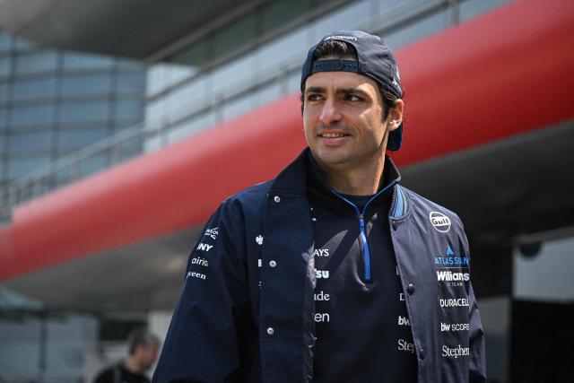 Williams' Spanish driver Carlos Sainz arrives at the paddock ahead of the Formula One Chinese Grand Prix at the Shanghai International Circuit in Shanghai on March 12, 2026. (Photo by Jade GAO / AFP)