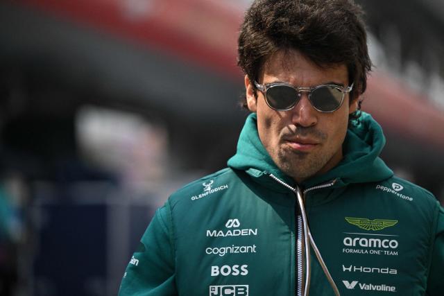 Aston Martin's Canadian driver Lance Stroll arrives at the paddock ahead of the Formula One Chinese Grand Prix at the Shanghai International Circuit in Shanghai on March 12, 2026. (Photo by Jade GAO / AFP)