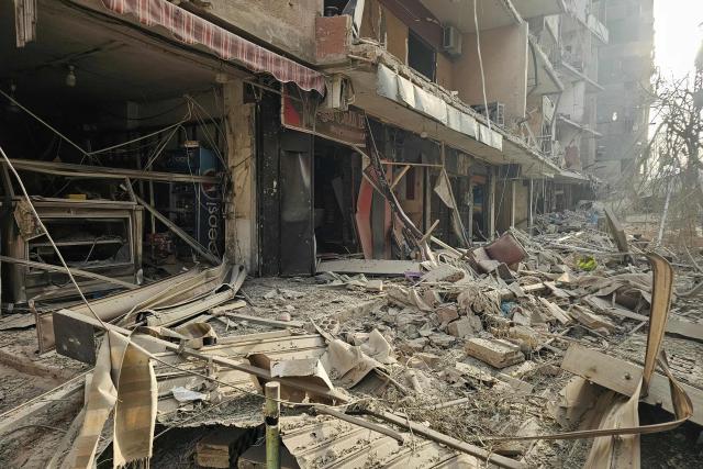 Damaged buildings are pictured at the site of overnight Israeli airstrikes in the southern suburbs of Beirut on March 12, 2026. Lebanon said an Israeli strike on central Beirut's seafront killed at least seven people early on March 12, another attack in the heart of the capital as Iran-backed Hezbollah launched more missiles at Israel.
The Israeli military said separately it had carried out strikes on Beirut's southern suburbs overnight against Hezbollah, which had announced a major new operation against Israel. (Photo by AFP) / 