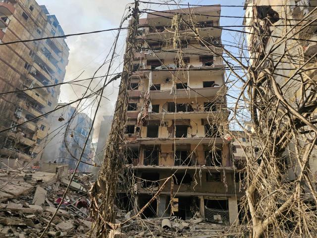 Damaged buildings are pictured at the site of overnight Israeli airstrikes in the southern suburbs of Beirut on March 12, 2026. Lebanon said an Israeli strike on central Beirut's seafront killed at least seven people early on March 12, another attack in the heart of the capital as Iran-backed Hezbollah launched more missiles at Israel.
The Israeli military said separately it had carried out strikes on Beirut's southern suburbs overnight against Hezbollah, which had announced a major new operation against Israel. (Photo by AFP) / 