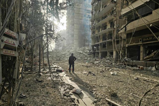 TOPSHOT - A man looks at the site of overnight Israeli airstrikes in the southern suburbs of Beirut on March 12, 2026. Lebanon said an Israeli strike on central Beirut's seafront killed at least seven people early on March 12, another attack in the heart of the capital as Iran-backed Hezbollah launched more missiles at Israel.
The Israeli military said separately it had carried out strikes on Beirut's southern suburbs overnight against Hezbollah, which had announced a major new operation against Israel. (Photo by AFP) / 