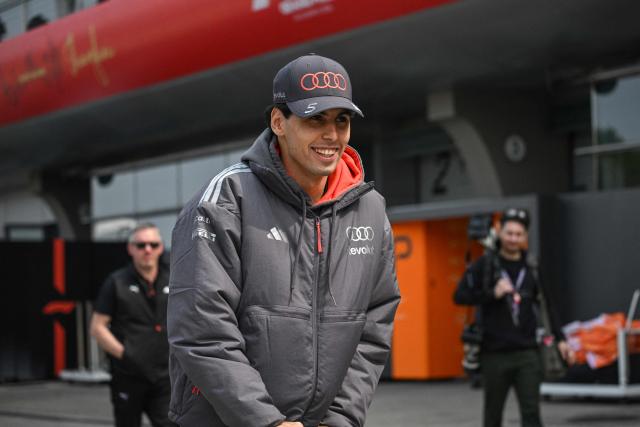 Audi's Brazilian driver Gabriel Bortoleto arrives at the paddock ahead of the Formula One Chinese Grand Prix at the Shanghai International Circuit in Shanghai on March 12, 2026. (Photo by Jade GAO / AFP)