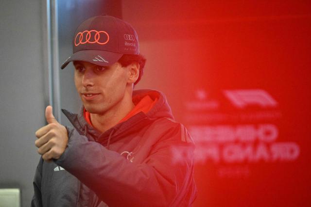Audi's Brazilian driver Gabriel Bortoleto arrives for a press conference ahead of the Formula One Chinese Grand Prix at the Shanghai International Circuit in Shanghai on March 12, 2026. (Photo by Jade GAO / AFP)