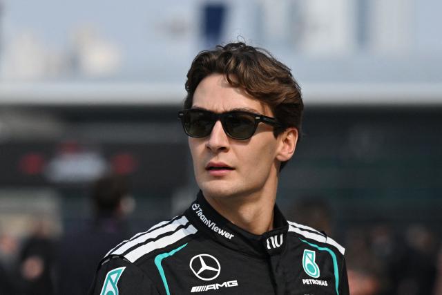 Mercedes' British driver George Russell walks in the paddock ahead of the Formula One Chinese Grand Prix at the Shanghai International Circuit in Shanghai on March 12, 2026. (Photo by GREG BAKER / AFP)