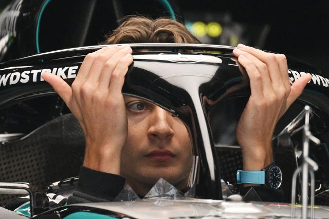 Mercedes' British driver George Russell gets out of his car during preparations ahead of the Formula One Chinese Grand Prix at the Shanghai International Circuit in Shanghai on March 12, 2026. (Photo by GREG BAKER / AFP)