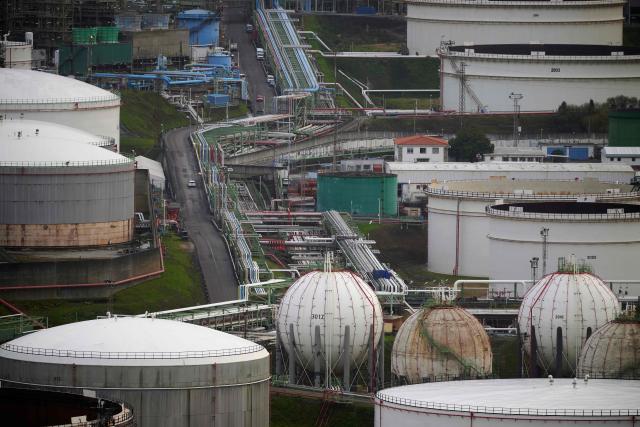 This photograph shows a general view of the Repsol oil refinery in A Coruna, northwestern Spain, on March 11, 2026. The US-Israeli war on Iran has expanded across the Gulf and beyond, upending global energy markets and trade, and virtually halting traffic in the Strait of Hormuz, through which a fifth of the world's crude oil travels. The 32 member countries of the International Energy Agency (IEA) decided to unlock 400 million barrels of oil from their reserves - the biggest such release ever- to ease the impact of the Middle East war. (Photo by MIGUEL RIOPA / AFP)
