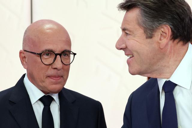 (FILES) President of Union des Droites pour la Republique (UDR) parliamentary group president and Nice mayoral candidate Eric Ciotti (L) stands next to French mayor of Nice and candidate for Horizons and Les Republicans for his reelection Christian Estrosi(R) shaking hands ahead of a debate broadcasted by French TV channel France TV/ICI Provence-Alpes-Cфte-d'Azur between the main candidates for France's upcoming municipal elections in Nice, southeastern France on March 4, 2026. The duel between Christian Estrosi and Eric Ciotti in Nice was shaping up to be merciless, but twists in the investigation into the severed pig’s head found in front of the incumbent mayor’s home are fueling conspiracy accusations and turning the campaign into the plot of a bad movie. (Photo by Valery HACHE / AFP)