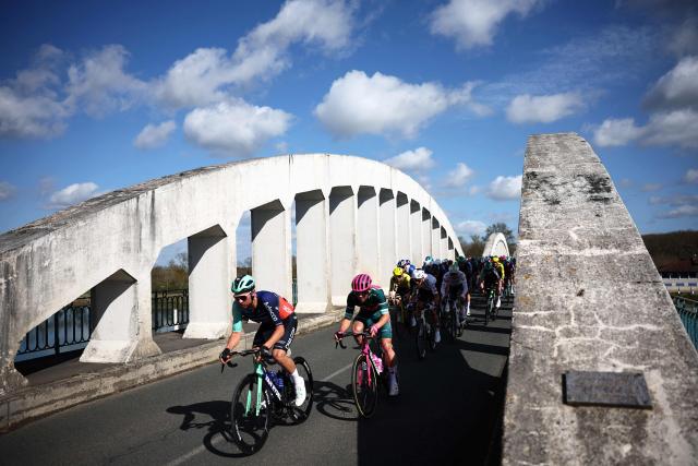 The pack rides during the 5th stage of the Paris-Nice cycling race, 206.3 km between Cormoranche-sur-Saône and Colombier-le-Vieux, on March 12, 2026. (Photo by Anne-Christine POUJOULAT / AFP)
