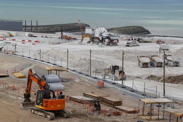 This photograph taken on March 12, 2026, shows the EPR2 construction site of the new reactors currently being built at the Penly nuclear power plant in Petit-Caux on the English channel coast. The nuclear recovery program announced in 2022 by France's President Emmanuel Macron provides for the construction of 6 new generation reactors known as EPR2, built in three pairs, at Penly, Gravelines and then at Bugey. (Photo by Ludovic MARIN / POOL / AFP)