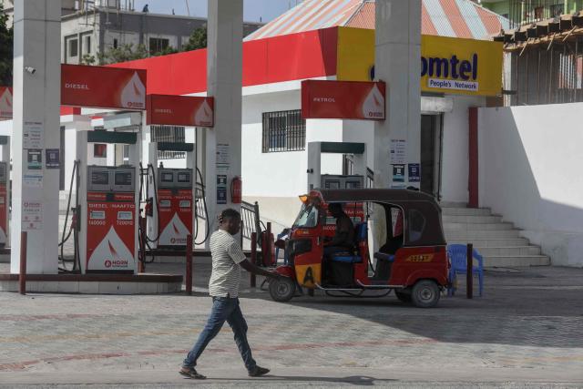 A general view of a tuk-tuk at a fuel station in Mogadishu on March 12, 2026. Petrol prices have doubled in Mogadishu from around $0.60 to $1.25 since the United States and Israel launched air strikes on Iran on February 28. 
Like many oil-importing countries, Somalia is feeling the effects of surging global oil prices as Iran's retaliatory strikes have targeted its Gulf neighbours and shipping through the vital Strait of Hormuz. (Photo by Hassan Ali ELMI / AFP)