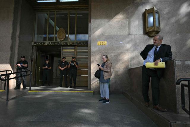 Police officers guard the entrance of the Judicial Power building in Buenos Aires on March 12, 2026. Argentinian Football Association (AFA) president Claudio "Chiqui" Tapia is expected to appear in court on March 12, 2026. (Photo by Luis ROBAYO / AFP)