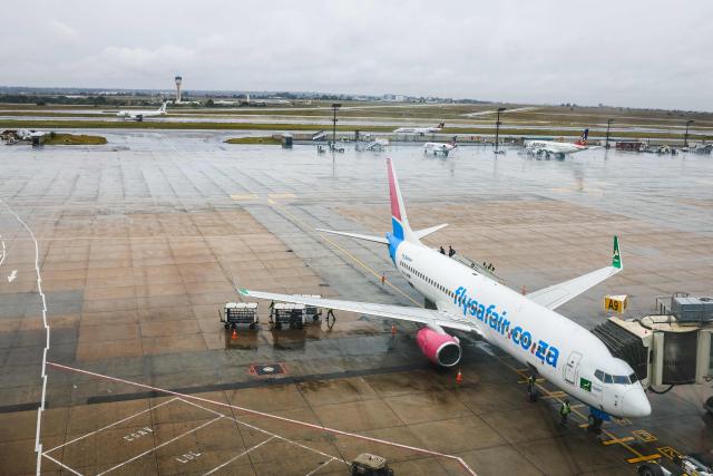 Airport ground staff attend the South African FlySafair low-cost airline Boeing 737-85P aircraft, while it is parked on the tarmac at OR Tambo International Airport in Ekurhuleni on March 12, 2026. Africa is feeling the impact of rising oil prices and threats to shipping, as the continent again suffers from events largely beyond its control.
Pump prices in Nigeria were up around 14 percent this week. (Photo by Phill Magakoe / AFP)