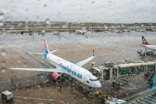 Airport ground staff attend the South African FlySafair low-cost airline Boeing 737-85P aircraft, while it is parked on the tarmac at OR Tambo International Airport in Ekurhuleni on March 12, 2026. Africa is feeling the impact of rising oil prices and threats to shipping, as the continent again suffers from events largely beyond its control.
Pump prices in Nigeria were up around 14 percent this week. (Photo by Phill Magakoe / AFP)