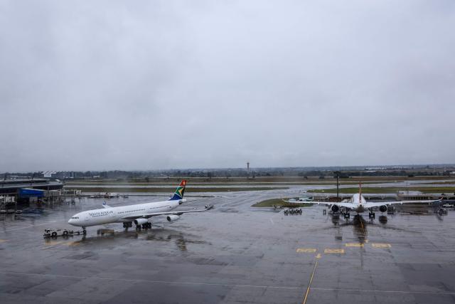 The South African Airways A340-300 aircraft (L) taxiis on the tarmac as another is parked after landing at OR Tambo International Airport in Ekurhuleni on March 12, 2026. Africa is feeling the impact of rising oil prices and threats to shipping, as the continent again suffers from events largely beyond its control.
Pump prices in Nigeria were up around 14 percent this week. (Photo by Phill Magakoe / AFP)