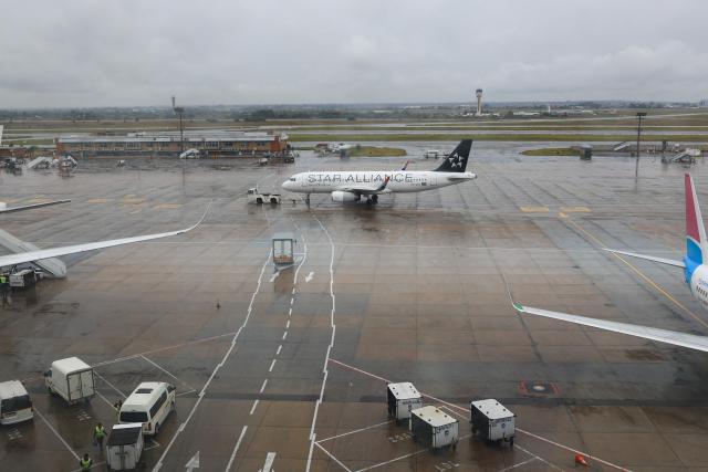 Staff attend the South African Airways (Star Alliance Livery) Airbus A320-232 aircraft as it is pulled on the tarmac at OR Tambo International Airport in Ekurhuleni on March 12, 2026. Africa is feeling the impact of rising oil prices and threats to shipping, as the continent again suffers from events largely beyond its control.
Pump prices in Nigeria were up around 14 percent this week. (Photo by Phill Magakoe / AFP)