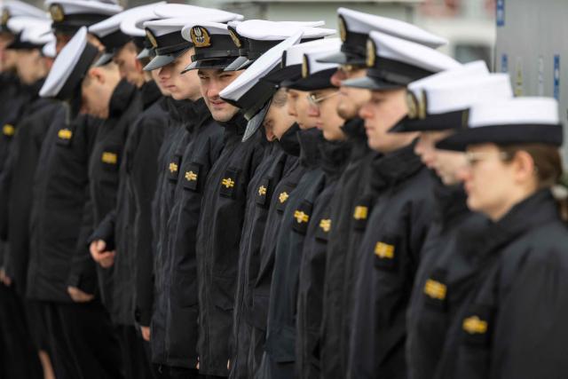 Polish Navy officers stand in lines as they as they wait for the welcoming ceremony before Poland's Deputy Prime Minister and Defence Minister (unseen) and Sweden's Defence Minister at the Polish Navy base in Gdynia on March 12, 2026. (Photo by Wojtek RADWANSKI / AFP)
