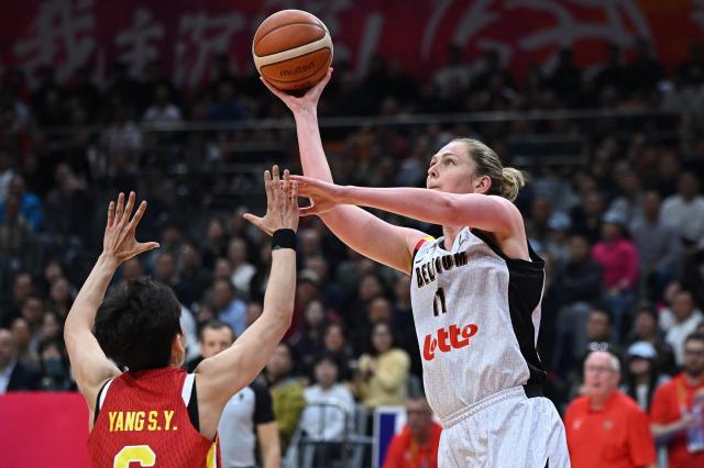 China's Shuyu Yang (L) and Belgium's Emma Meesseman compete for the ball during the FIBA Women's Basketball World Cup 2026 qualifying tournament match between China and Belgium in Wuhan, in China's central Hubei province on March 12, 2026. (Photo by CN-STR / AFP) / China OUT