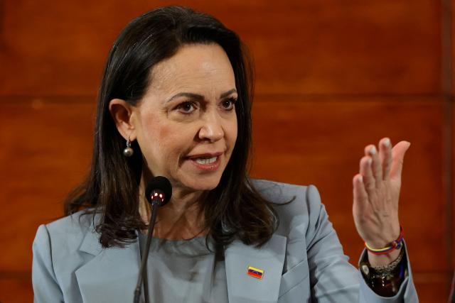 Venezuelan opposition leader Maria Corina Machado gestures as she delivers a press conference in Santiago, on March 12, 2026. Machado travelled to Chile to attend Chile's President Jose Antonio Kast's inauguration. (Photo by Raul BRAVO / AFP)