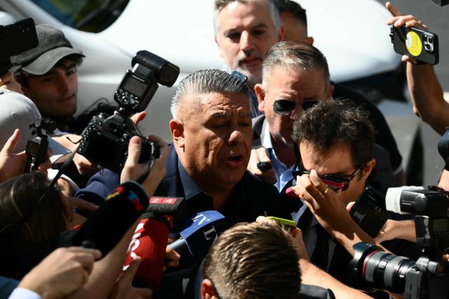 Argentine Football Association (AFA) president Claudio "Chiqui" Tapia arrives to testify at the National Court for Economic Crimes in Buenos Aires on March 12, 2026. Tapia and other AFA officials are under investigation to determine whether the association improperly withheld and failed to deposit money for taxes and pension contributions between 2024 and 2025, amounting to approximately 19 billion pesos (about 13 million dollars). (Photo by Luis ROBAYO / AFP)