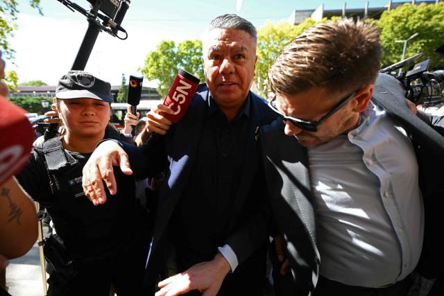 Argentine Football Association (AFA) president Claudio "Chiqui" Tapia arrives to testify at the National Court for Economic Crimes in Buenos Aires on March 12, 2026. Tapia and other AFA officials are under investigation to determine whether the association improperly withheld and failed to deposit money for taxes and pension contributions between 2024 and 2025, amounting to approximately 19 billion pesos (about 13 million dollars). (Photo by Luis ROBAYO / AFP)