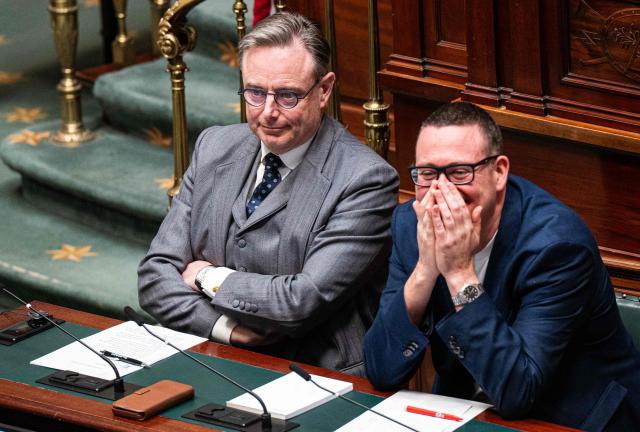Belgium's Prime Minister Bart De Wever (L) and Belgium's President of PVDA - PTB Raoul Hedebouw attend a plenary session of the Chamber at the Federal Parliament in Brussels on March 12, 2026. (Photo by EMILE WINDAL / Belga / AFP) / Belgium OUT