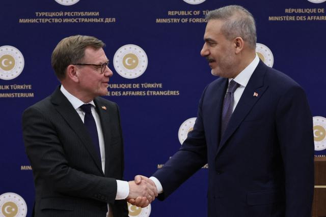 Turkey's Foreign Minister Hakan Fidan (R) shakes hands with Germany's Foreign Minister Johann Wadephul as they attend a joint press conference following their meeting in Ankara on March 12, 2026. (Photo by Adem ALTAN / AFP)