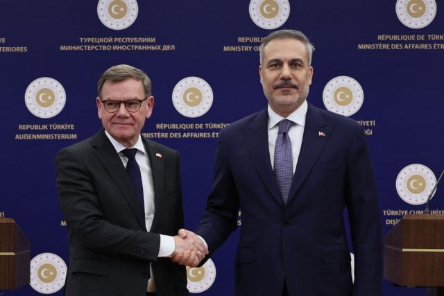 Turkey's Foreign Minister Hakan Fidan (R) shakes hands with Germany's Foreign Minister Johann Wadephul as they attend a joint press conference following their meeting in Ankara on March 12, 2026. (Photo by Adem ALTAN / AFP)