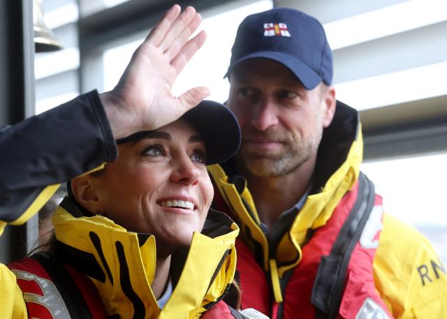 Britain's Catherine, Princess of Wales, waves to well wishers during a visit to the Royal National Lifeboat Institution (RNLI) Tower Lifeboat Station to meet staff and volunteers along the River Thames in London on March 12, 2026, to mark the 25th anniversary of the RNLI Lifeguards. (Photo by Chris Jackson / POOL / AFP)