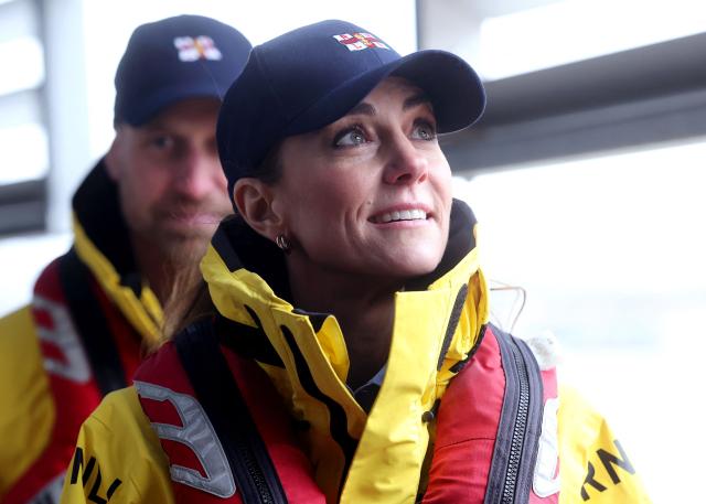 Britain's Catherine, Princess of Wales, looks on during a visit to the Royal National Lifeboat Institution (RNLI) Tower Lifeboat Station to meet staff and volunteers along the River Thames in London on March 12, 2026, to mark the 25th anniversary of the RNLI Lifeguards. (Photo by Chris Jackson / POOL / AFP)