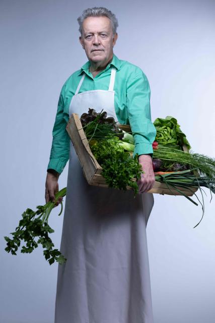 Michelin-starred French chef Alain Passard, known for his exclusively vegetable-based cuisine, poses with vegetables from his garden during a photo session in Paris on March 6, 2026. (Photo by JOEL SAGET / AFP)