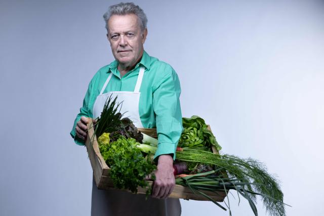 Michelin-starred French chef Alain Passard, known for his exclusively vegetable-based cuisine, poses with vegetables from his garden during a photo session in Paris on March 6, 2026. (Photo by Joel Saget / AFP)