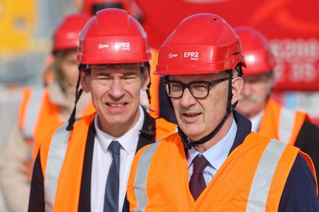 France's Higher Education and Research Minister Philippe Baptiste (L) and France's Economy and Finance Minister Roland Lescure attend a visit of the EPR2 new generation reactors construction site at the Penly nuclear power plant in Petit-Caux on the English channel coast on March 12, 2026. The nuclear recovery program announced in 2022 by France's President Emmanuel Macron provides for the construction of 6 new generation reactors known as EPR2, built in three pairs, at Penly, Gravelines and then at Bugey. (Photo by Ludovic MARIN / POOL / AFP)