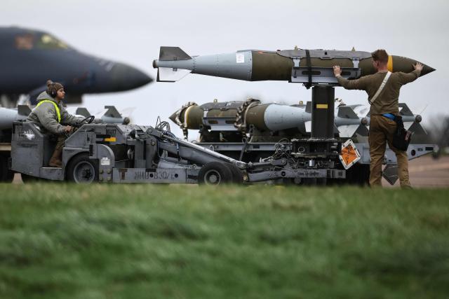 USAF military ground personnel prepare Joint Direct Attack Munitions (JDAM) for a US Air Force (USAF) B-1 Lancer bomber on the tarmac at RAF Fairford in south-west England on March 12, 2026. Fairford is one of two bases, along with the Diego Garcia facility in the Indian Ocean, that the UK has given the US permission to use for "specific defensive operations into Iran" to destroy Iranian missiles at source, the British defence minister said in a statement. (Photo by Henry Nicholls / AFP)