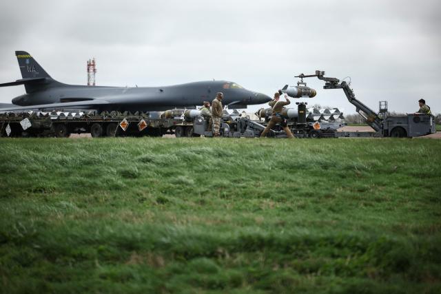USAF military ground personnel prepare Joint Direct Attack Munitions (JDAM) for a US Air Force (USAF) B-1 Lancer bomber on the tarmac at RAF Fairford in south-west England on March 12, 2026. Fairford is one of two bases, along with the Diego Garcia facility in the Indian Ocean, that the UK has given the US permission to use for "specific defensive operations into Iran" to destroy Iranian missiles at source, the British defence minister said in a statement. (Photo by Henry Nicholls / AFP)