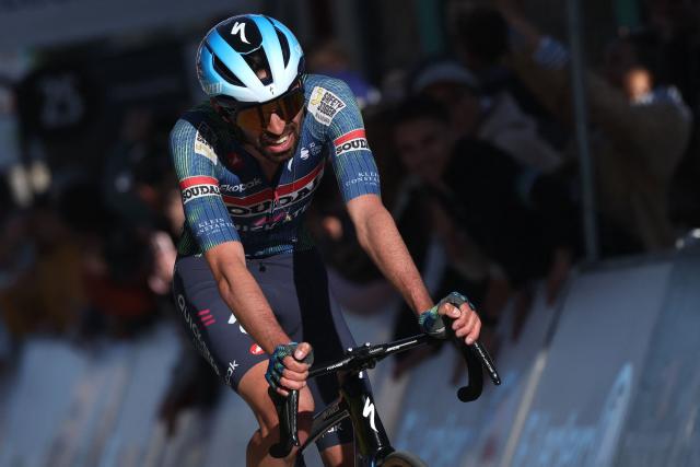 Soudal Quick-Step's French rider Valentin Paret-Peintre crosses the line to finish second in the 5th stage of the Paris-Nice cycling race, 206.3 km between Cormoranche-sur-Saône and Colombier-le-Vieux, on March 12, 2026. (Photo by Anne-Christine POUJOULAT / AFP)