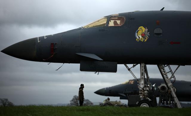 USAF military ground personnel prepare Joint Direct Attack Munitions (JDAM) for a US Air Force (USAF) B-1 Lancer bomber jet on the tarmac at RAF Fairford in south-west England on March 12, 2026. Fairford is one of two bases, along with the Diego Garcia facility in the Indian Ocean, that the UK has given the US permission to use for "specific defensive operations into Iran" to destroy Iranian missiles at source, the British defence minister said in a statement. (Photo by Henry NICHOLLS / AFP)