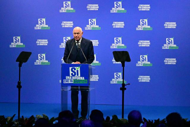 Italy's Justice Minister Carlo Nordio, speaks during a campaign meeting of Italian right wing party Brothers of Italy (Fratelli d'Italia) (Fdi) to support the "Yes" to Justice referendum, in Milan on March 12, 2026. (Photo by Stefano RELLANDINI / AFP)