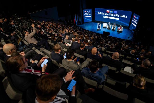Poland's Deputy Prime Minister and Defence Minister Wladyslaw Kosiniak-Kamysz and Sweden's Defence Minister Pal Jonson react on stage during the Baltic Sea Security Talks in Gdansk on March 12, 2026. (Photo by Wojtek RADWANSKI / AFP)
