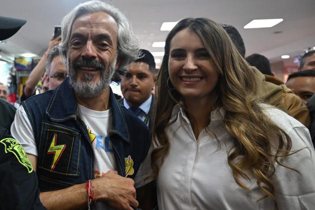 Colombia's presidential candidate for the conservative Democratic Centre party, Paloma Valencia (R), presents her running mate, Juan Daniel Oviedo, in Bogota, on March 12, 2026. Colombia will holds presidnetial elections on May 31st. (Photo by RAUL ARBOLEDA / AFP)