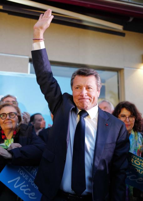 French mayor of Nice and candidate to his reelection Christian Estrosi waves during his last campaign rally in Nice, southeastern France, on March 12, 2026. French voters head to the polls for municipal elections on March 15 and 22, 2026. (Photo by Valery HACHE / AFP)