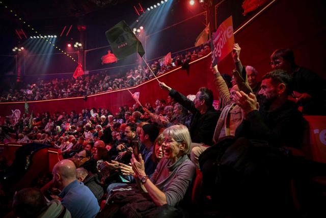People cheer at the start of a campaign meeting of Paris' mayoral left-wing candidate Emmanuel Gregoire in Paris on March 12, 2026, ahead of France's municipal elections. French voters are scheduled to head to the polls for municipal elections on March 15 and March 22, 2026. (Photo by Martin LELIEVRE / AFP)