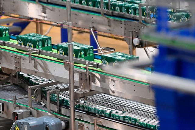 This photograph shows cans on the production line of Perrier's natural sparkling mineral water factory in Vergeze, southern France, on March 12, 2026. (Photo by Sylvain THOMAS / AFP)